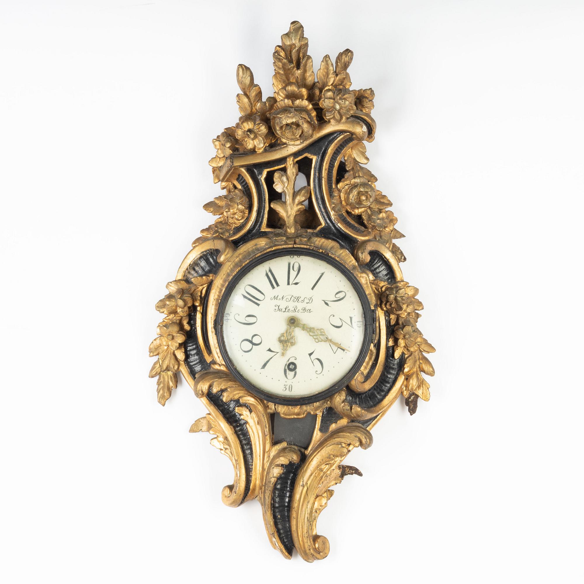 A Rococo wall clock, second half of the 18th Century.