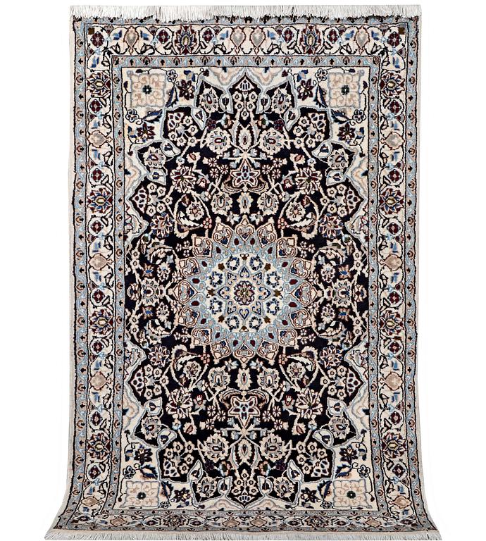 A Nain rug, part silk, 9 laa, c. 210 x 119 cm.