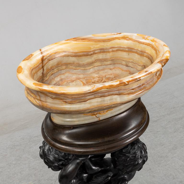 A wooden pedestal with onyx bowl, 20th Century.