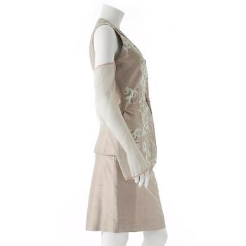 GIANFRANCO FERRÉ, a beige three-piece ensemble consisting of vest , trousers and skirt.