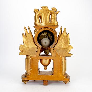 An Empire gilded table clock marked Vaillant Paris.