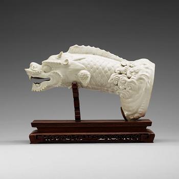 1604. A blanc de chine figure of a dragonfish, Qing dynasty, presumably 18th Century.