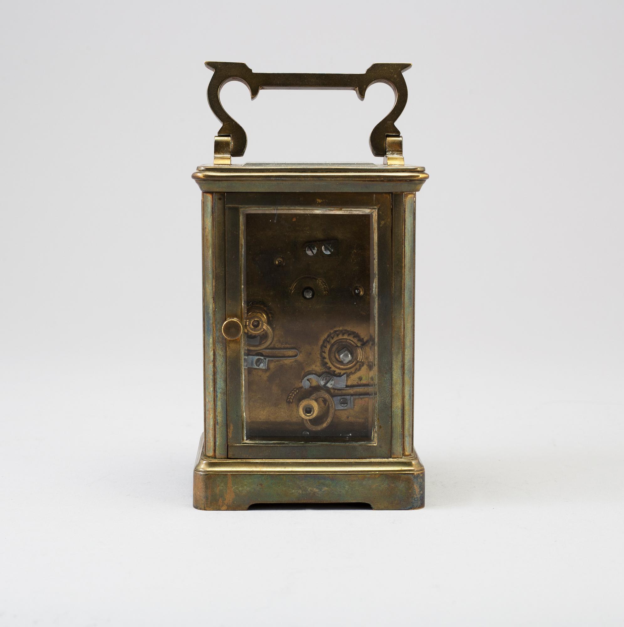 An early 20th century brass and glass carriage clock.