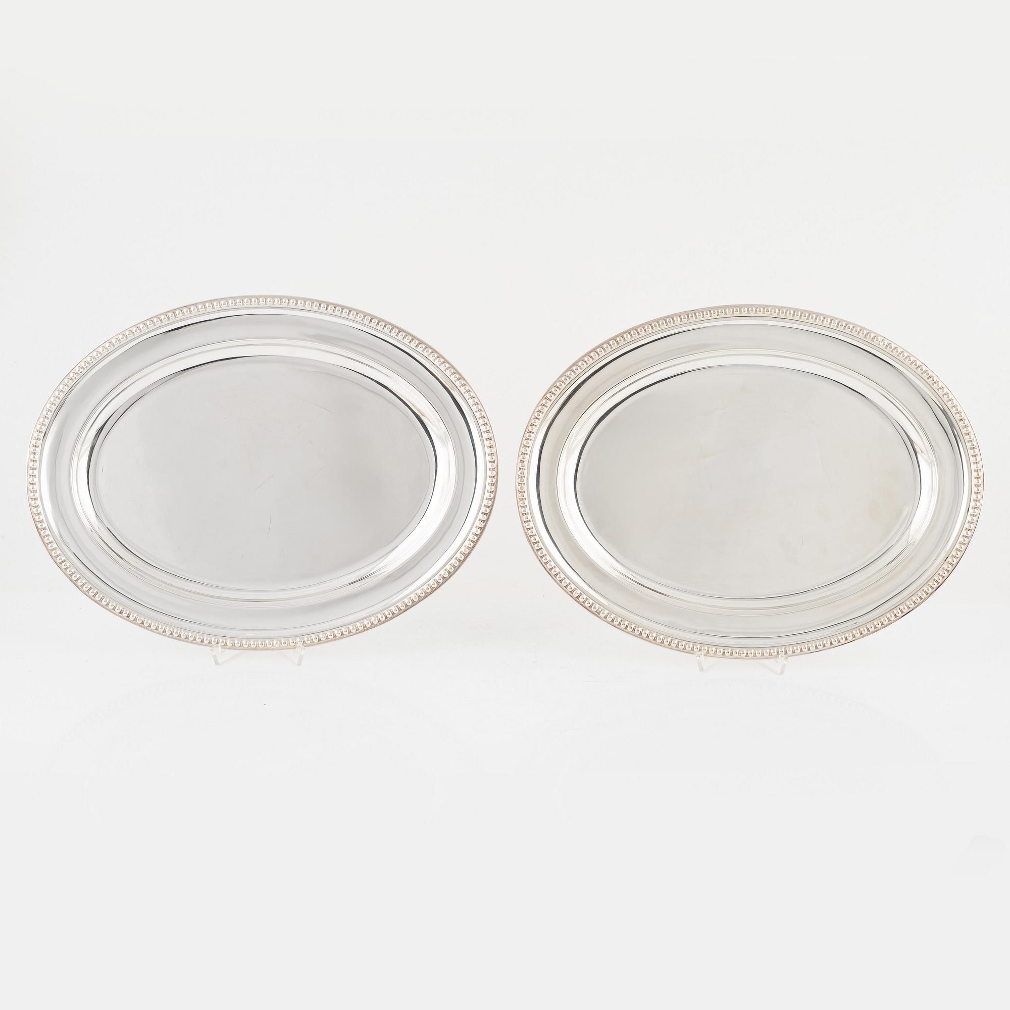 A pair of silver plated chargers, mark of Johnson & Co, Birmingham (active 1879-1899).