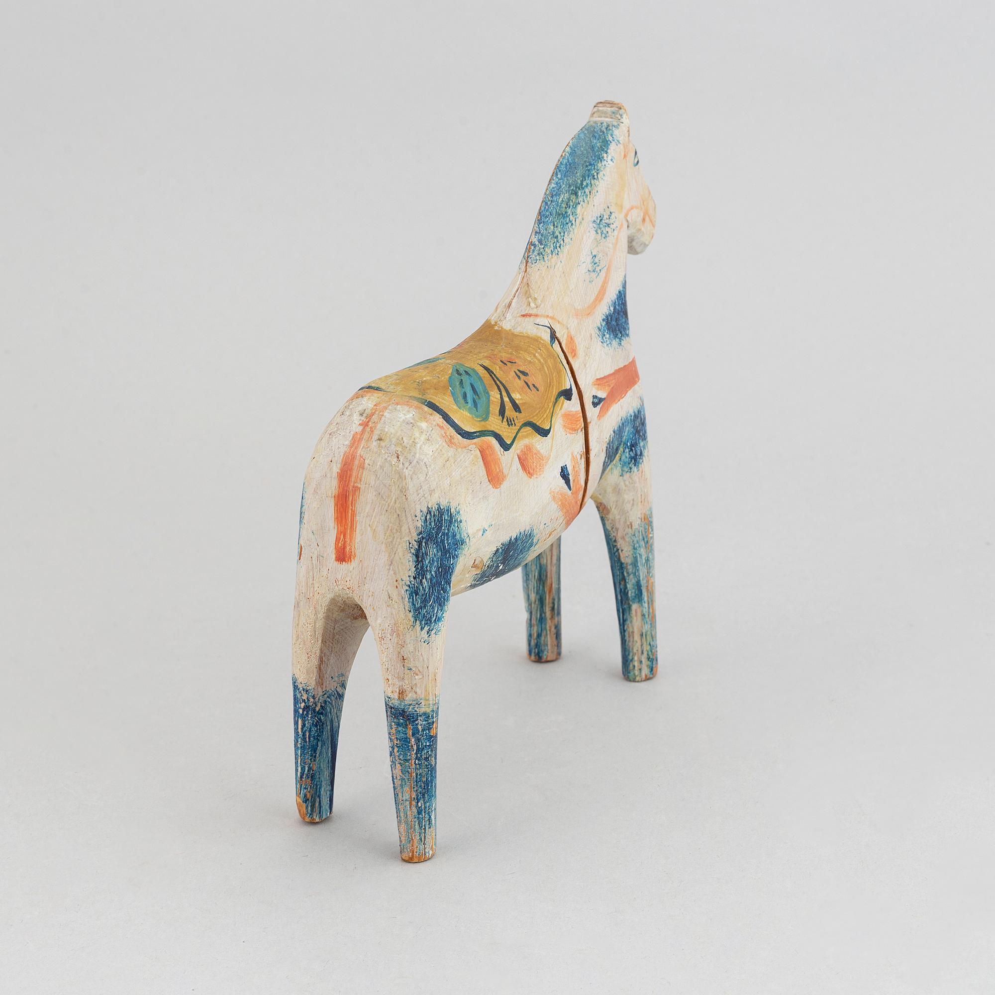 A wooden carved and painted 'Dalahäst', early or mid 20th century.