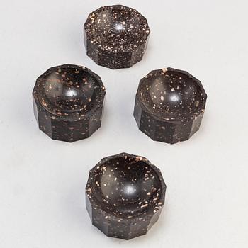 Three plus one porphyry salt cellars, Empire, second quarter of the 19th century.