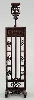 A hardwood lantern stand, with carved stylized dragons, presumably late Qing dynasty.