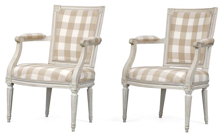 A pair of Louis XVI armchairs.