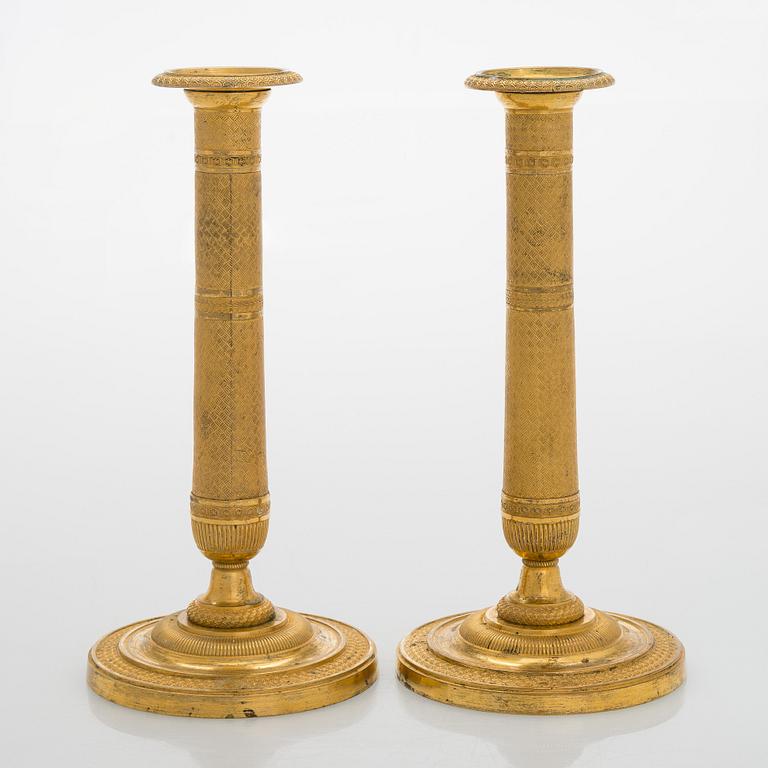A pair of early 19th century French Empire candlesticks.