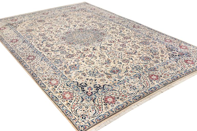 A Nain, part silk carpet, c. 474 x 322 cm.
