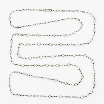 An antique platinum diamond long chain.