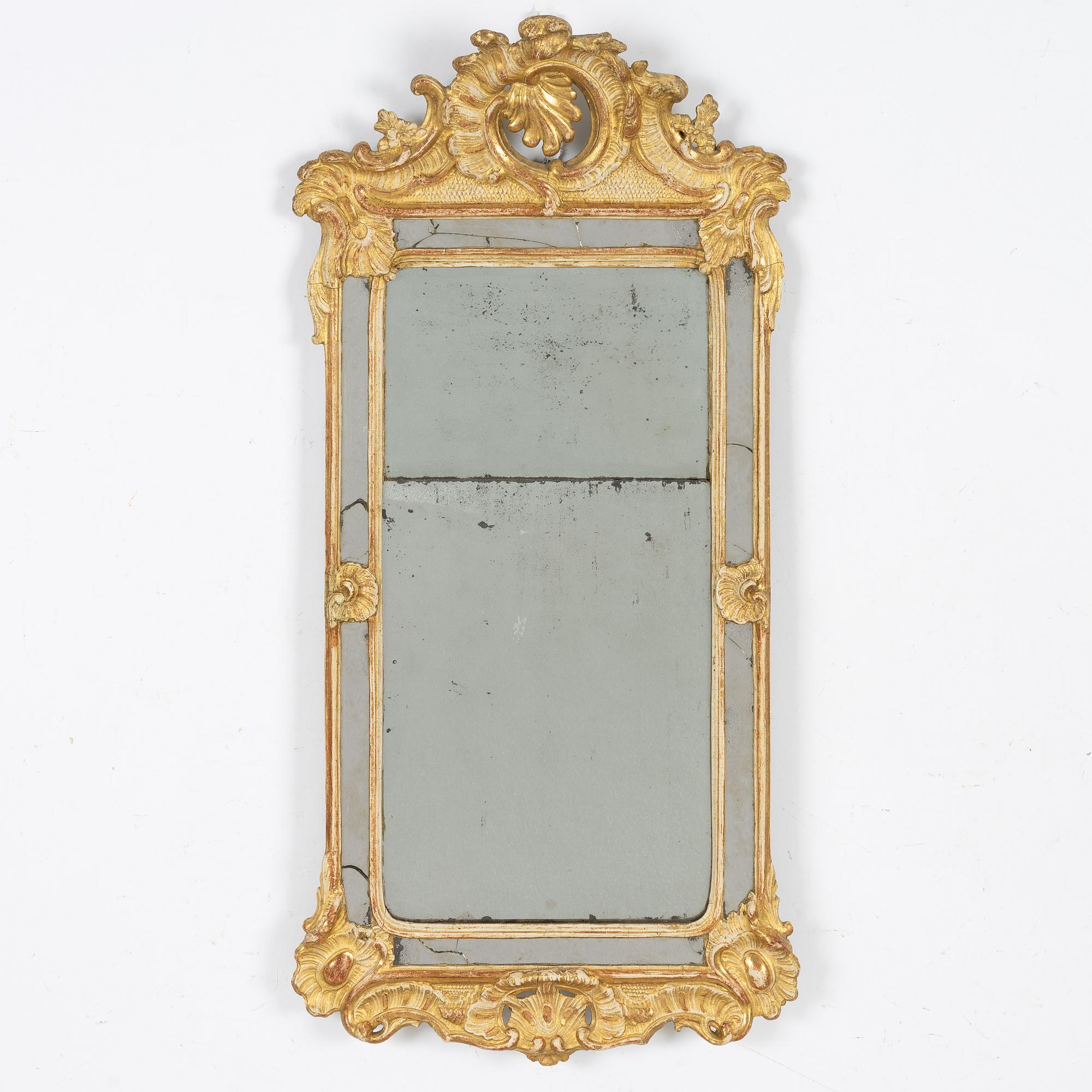 A giltwood rococo mirror, Stockholm, later part 18th century.