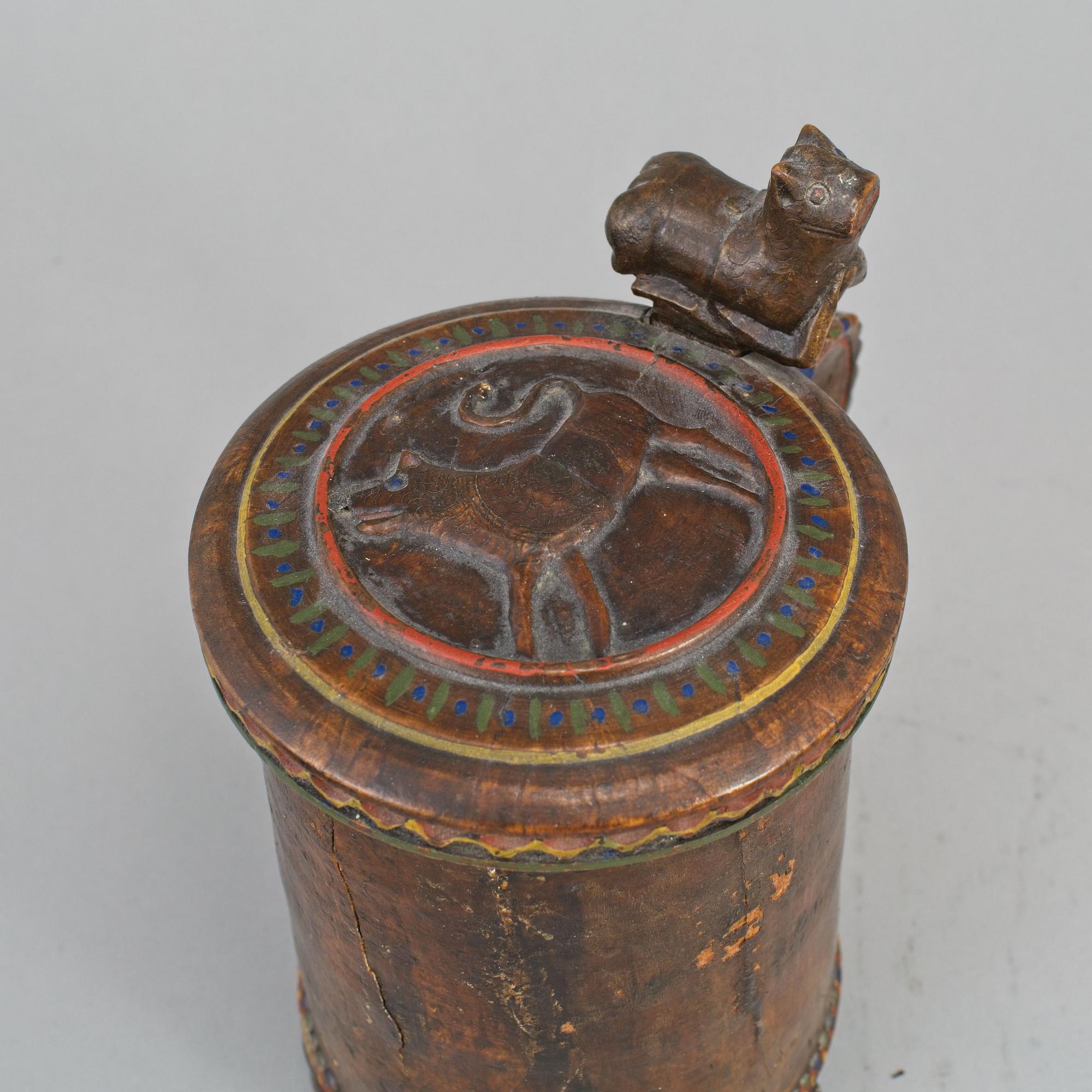 A 19th century painted wooden tankard.