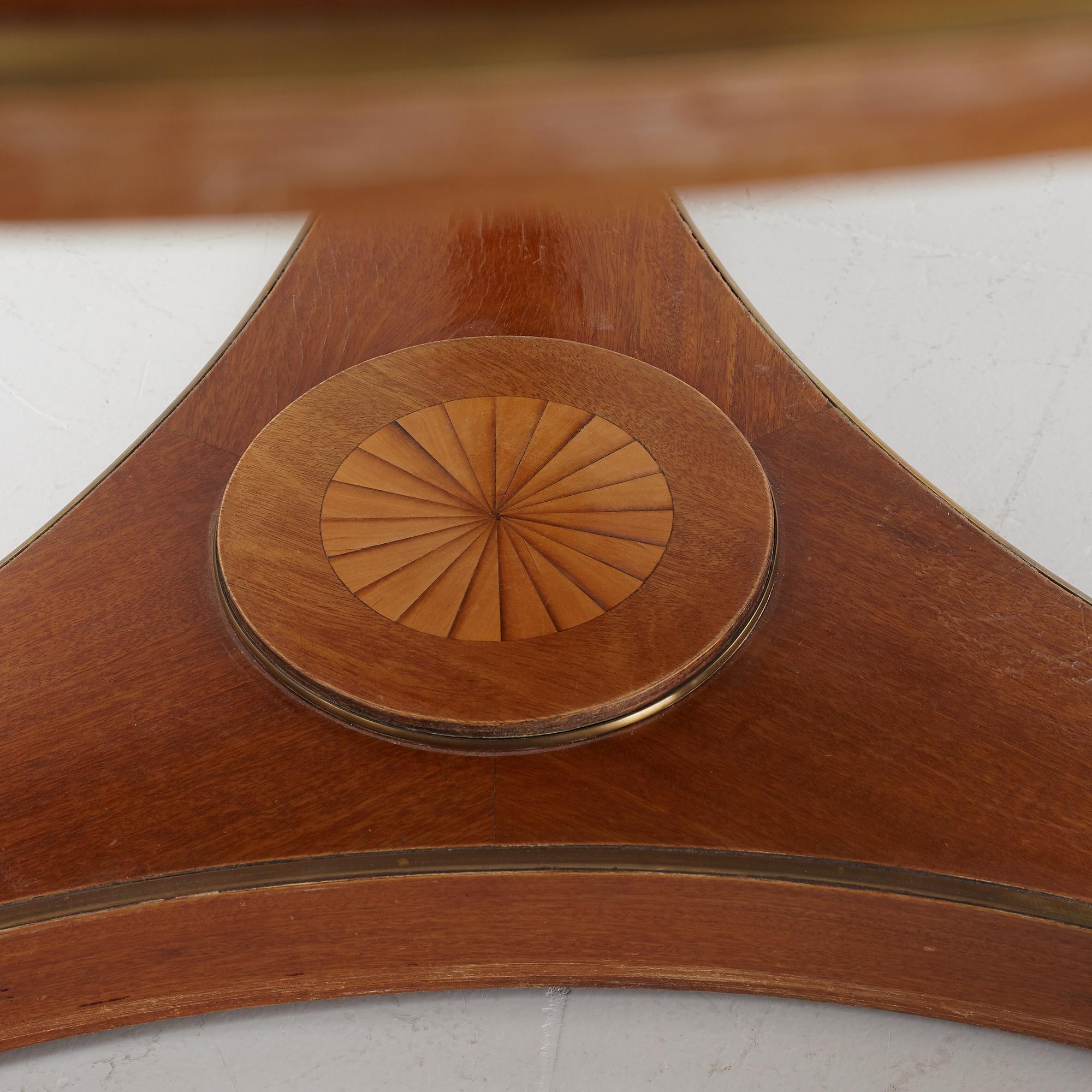 A mahogany veneered Empire style table, first half the 20th Century.