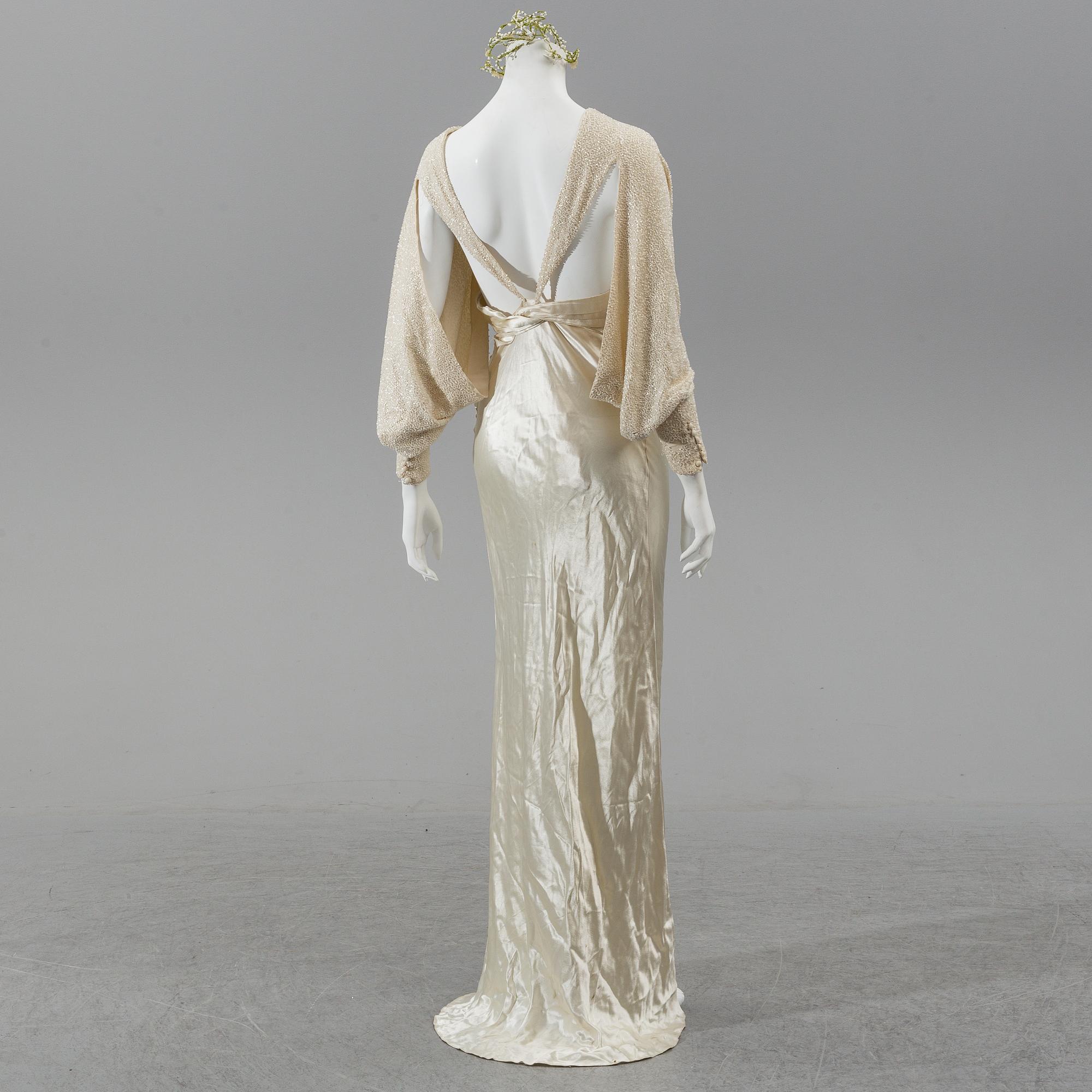 A satin wedding dress, circa 1935.