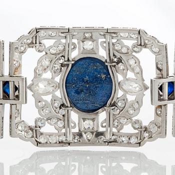 A platinum bracelet set with lapis lazuli, old-cut diamonds with a total weight of ca 10 cts and synthetic sapphires.