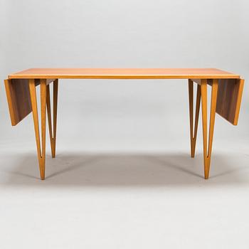 A mid-20th century dining table.