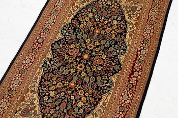 A Hereke silk rug, c. 130 x 71 cm.