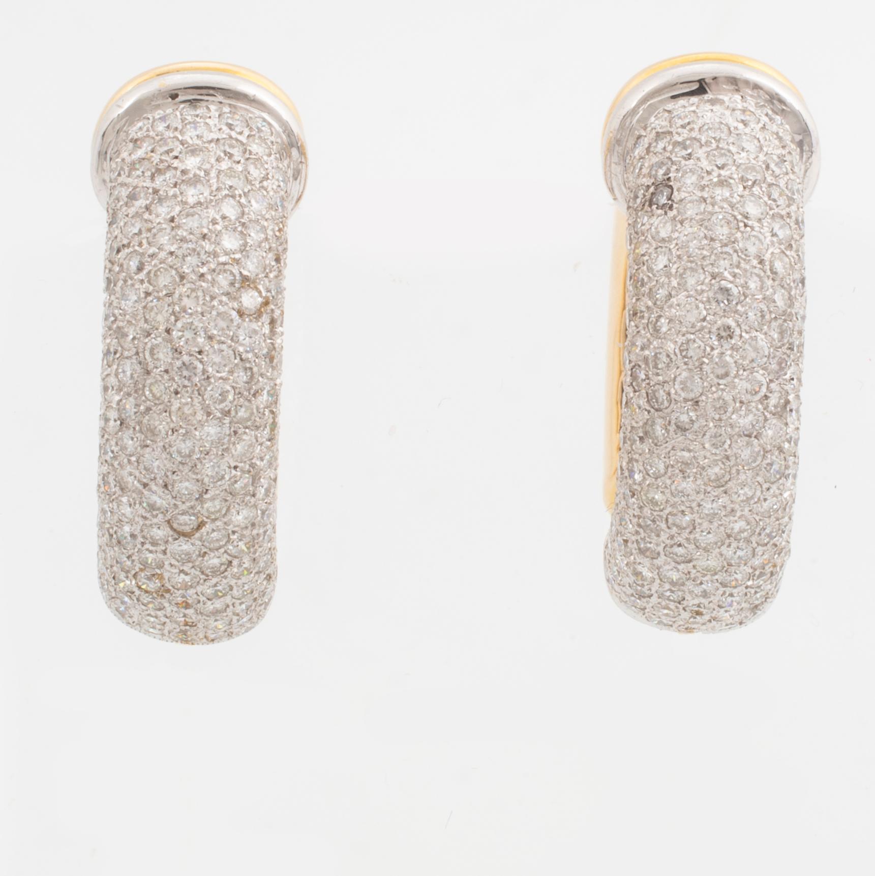 Gold and brilliant-cut diamond hoop earrings.