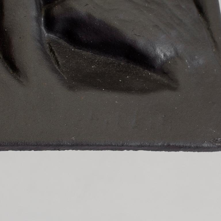 MICHAEL SCHILKIN, a cast iron plaque "See no evil, hear no evil, say no evil", signed and dated Högfors 1961.