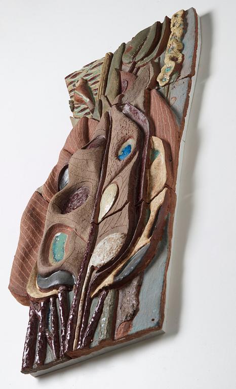 Tyra Lundgren, a stoneware relief 'A bird is singing at dawn among large leaves', Sweden 1950's.