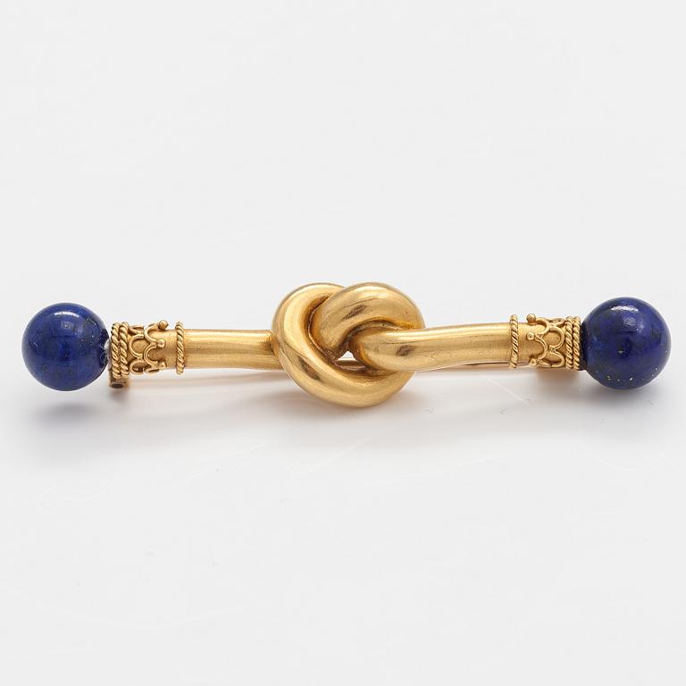 An 18K gold brooch, needle 14K gold, with lapiz lazuli.