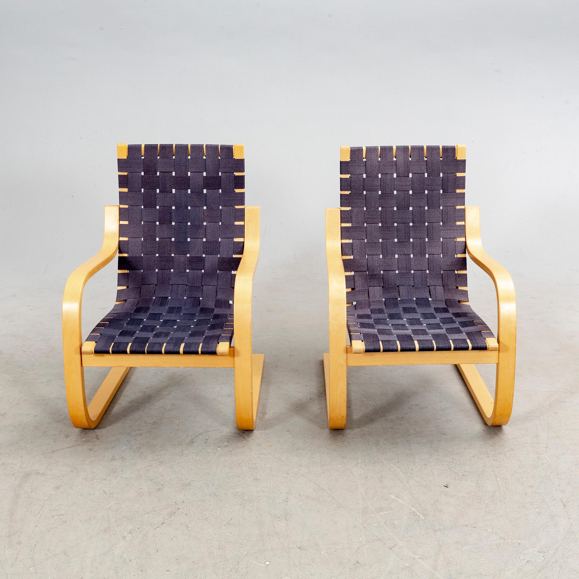 Alvar Aalto, a pair of birch armchairs model 406 21st century.