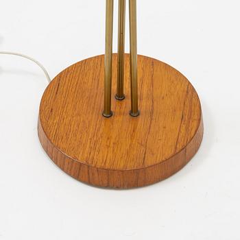 A brass and teak floor light, 1950's.
