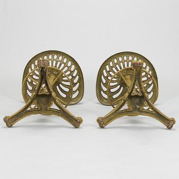 Four bar stools, painted cast iron, partly from the early 20th century.