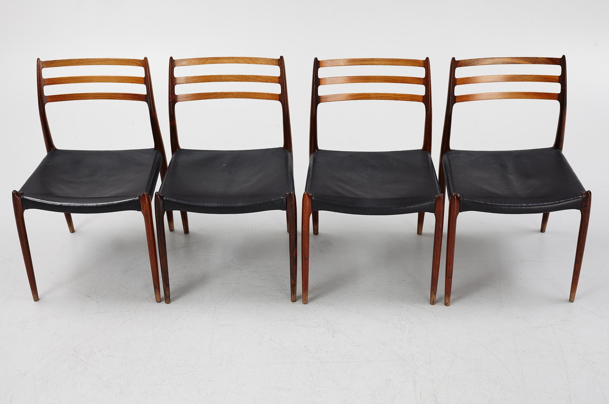 Niles Otto Møller, a rosewood veneered table with four chairs, JL Møller, Denmark, 1950's/60's.