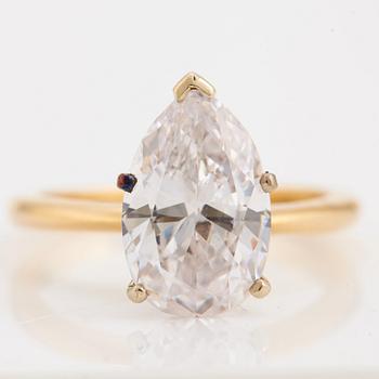 A pear cut diamond ring.