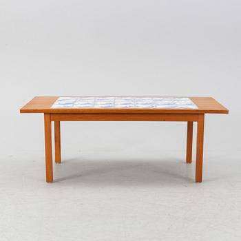 A teak coffee table with inlaid tiles. Second half of the 20th Century.