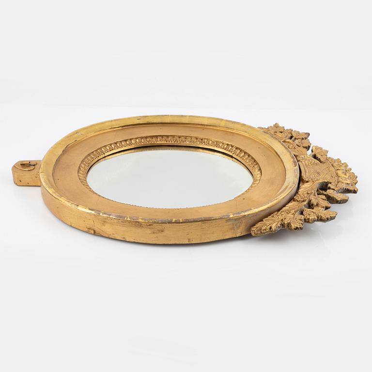 An Empire giltwood mirrored wall sconce by J. M. Berg (active in Gothenburg 1803- ca 1837).