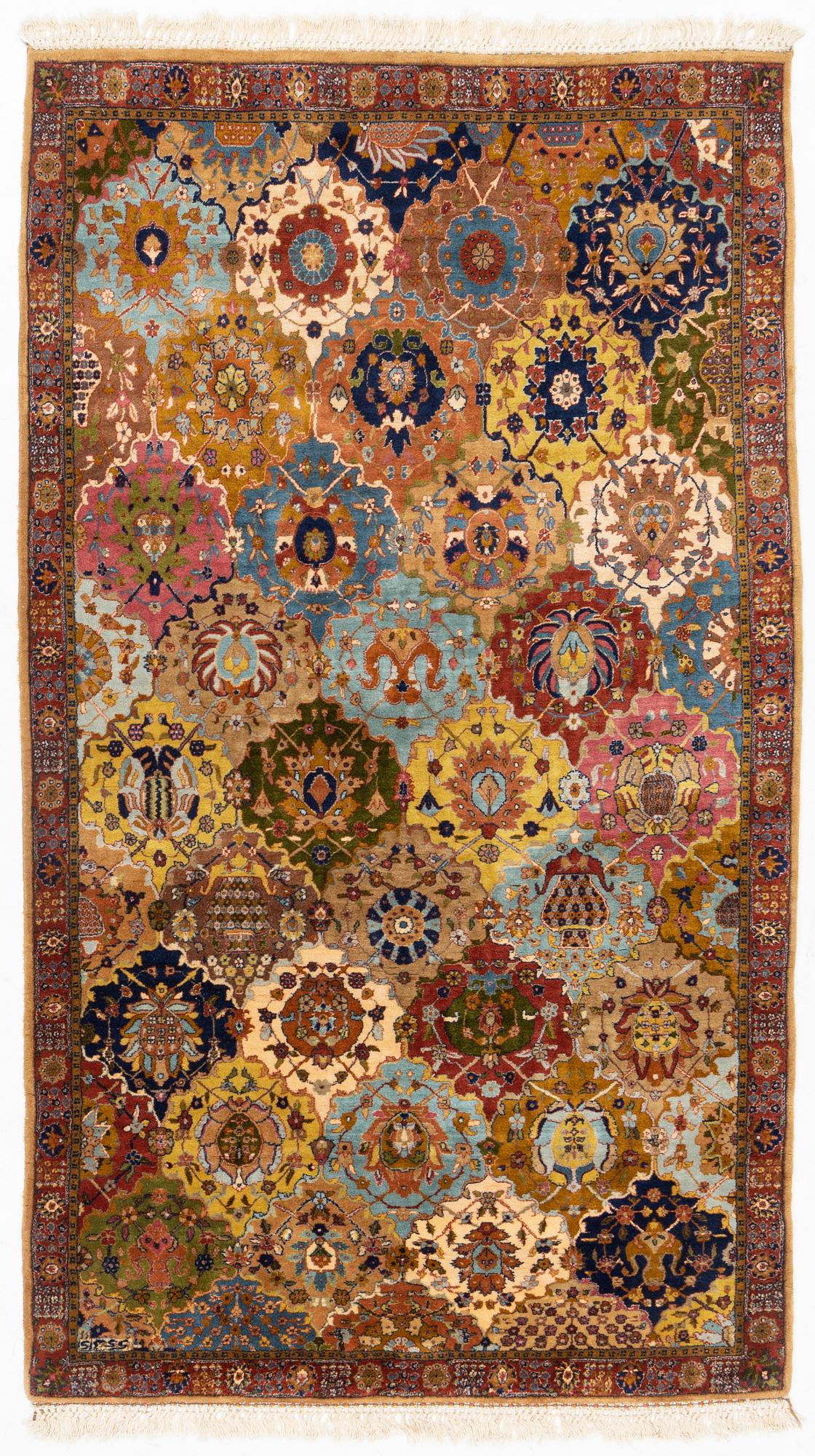 A semi-antique Safavid 'vase' design rug from Lahore, c. 243 x 141 cm.