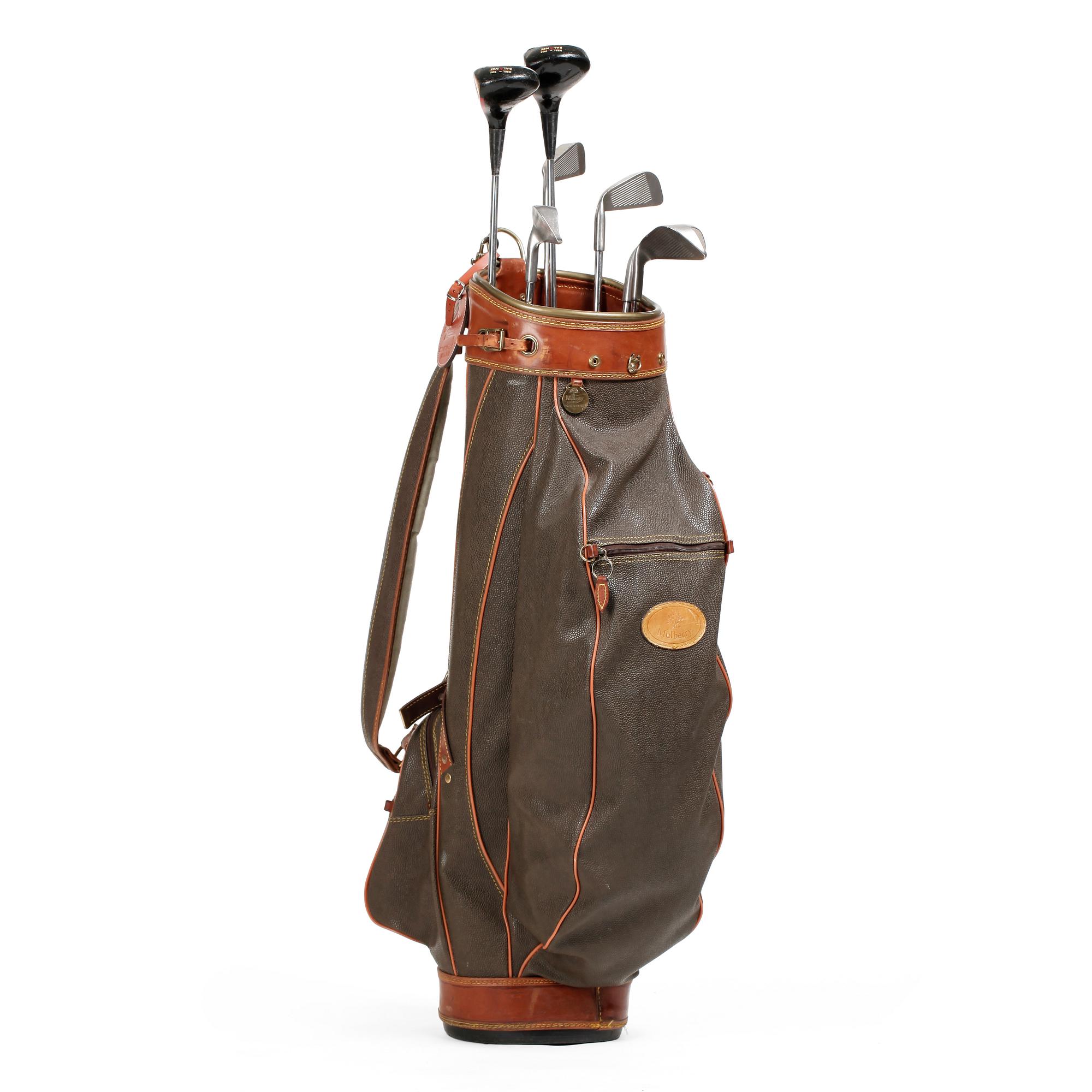 MULBERRY, a green leather golf bag with golf clubs.