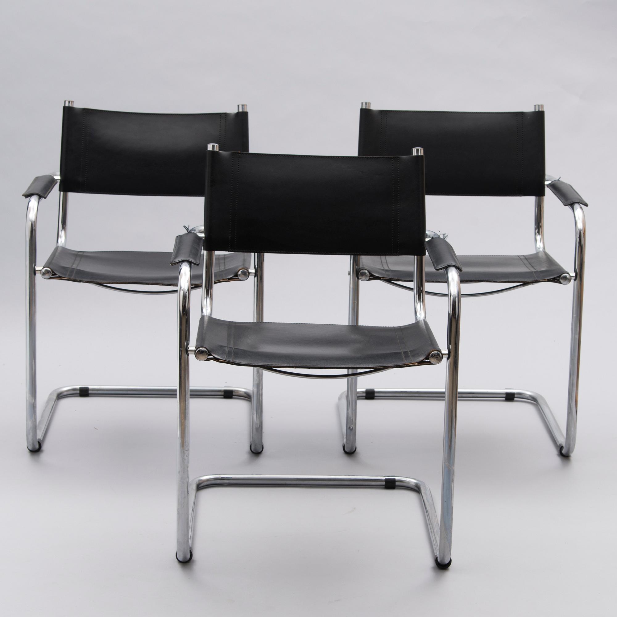 A Set of Three Chrome and Black Leather Chairs.