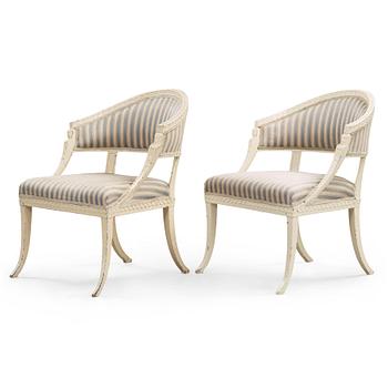 A pair of late Gustavian armchairs in the manner of Ephraim Ståhl, master in Stockholm 1794-1820.