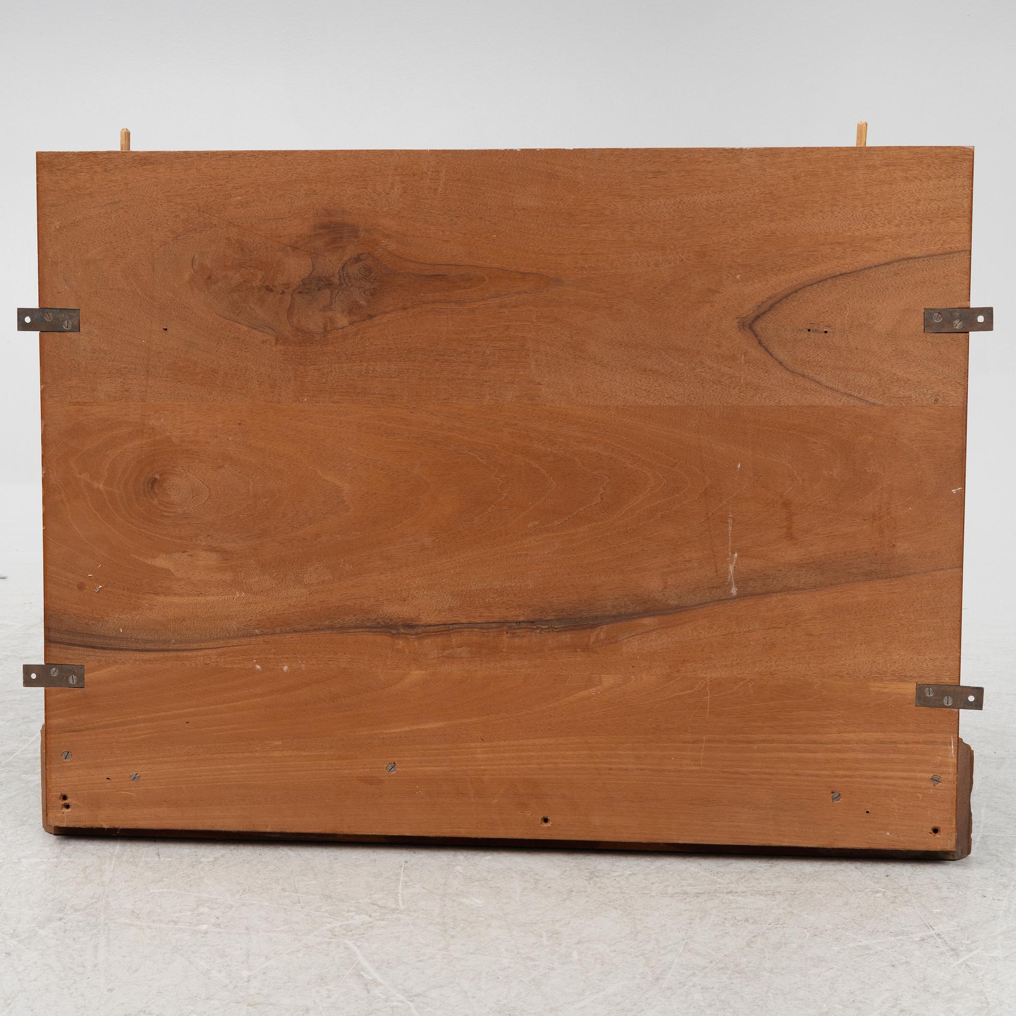 A mahogany panel, 20th century.