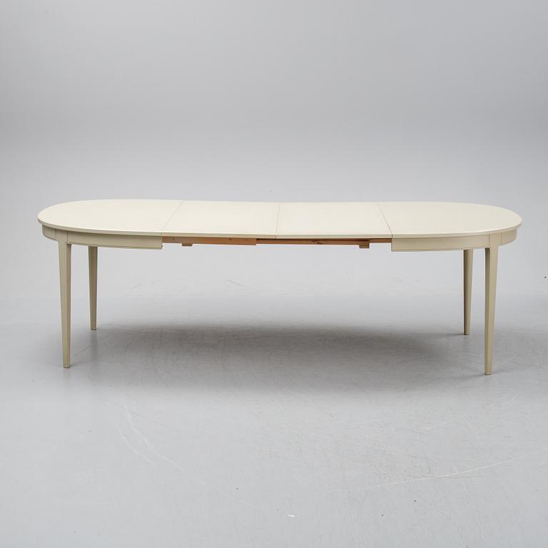 A dining table with six chairs by Carl Malmsten, second half of the 20th Century.