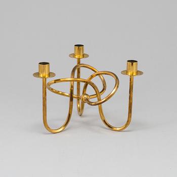 JOSEF FRANK, ljusstake, mässing ”Vänskapsknuten”, Firma Svenskt Tenn, 1900-tal.