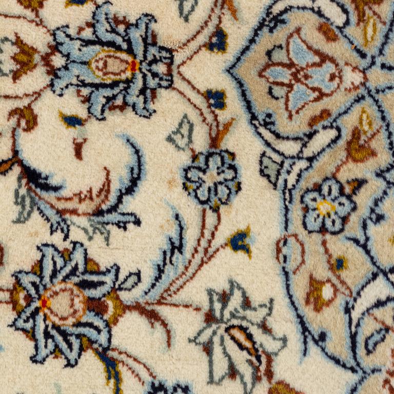 A Keschan carpet, signed, c. 350 x 245 cm.