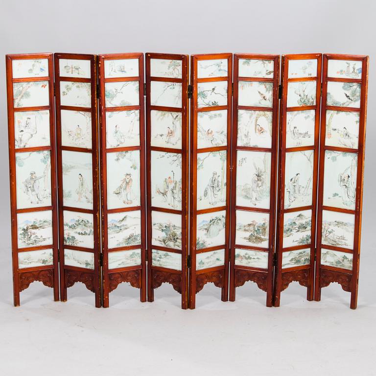 A Chinese folding screen with 48 porcelain tiles, late Qing dynasty, signed Ren Huanzhang, and dated 1881.