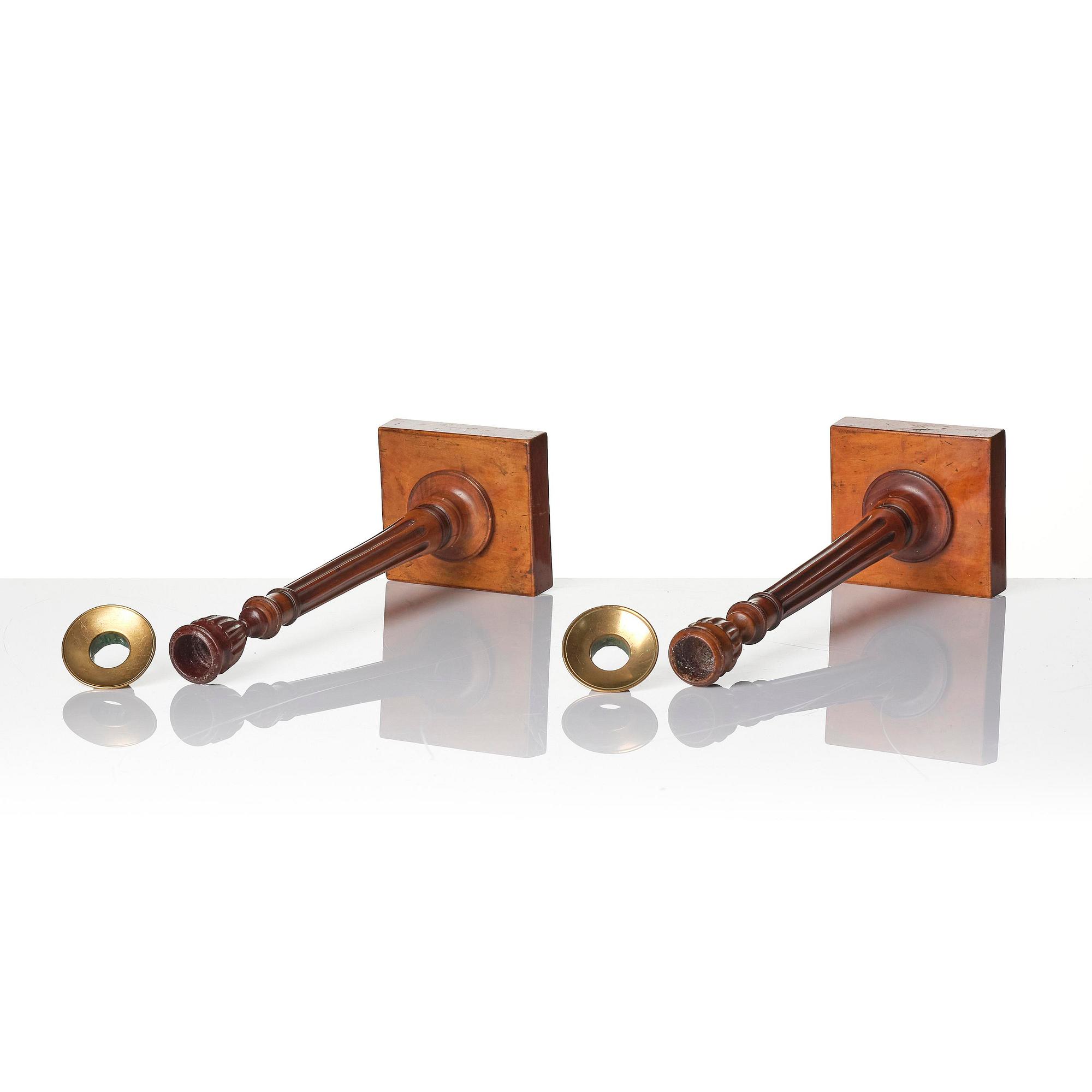 A pair of George III mahogany candlesticks, circa 1800.