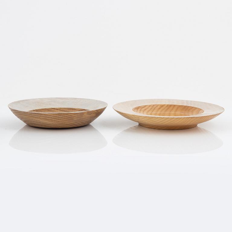 Magnus Ek, a set of seven ash wood plates for Oaxen Krog, 2020.