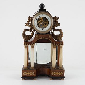 A presumably Austrian mahogany, gilt-brass, and alabaster portico mantel clock, early 19th century.