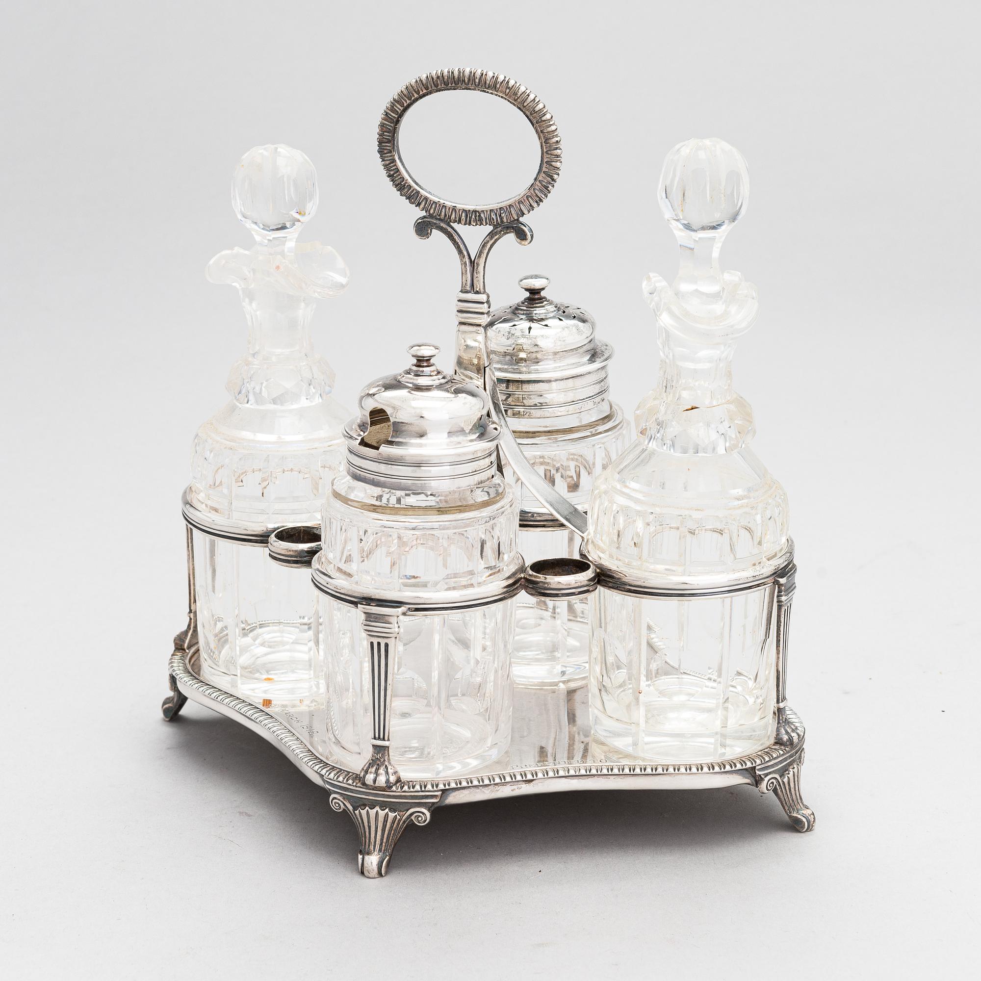 Glass and sterling silver cruet stand, maker's marks of Samuel Hennell and Robert Hennell III, London 1811 and 1879.