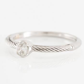 Ring 18K white gold with an oval-cut diamond.