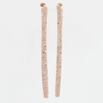 Rose gold and diamond hoop earrings.