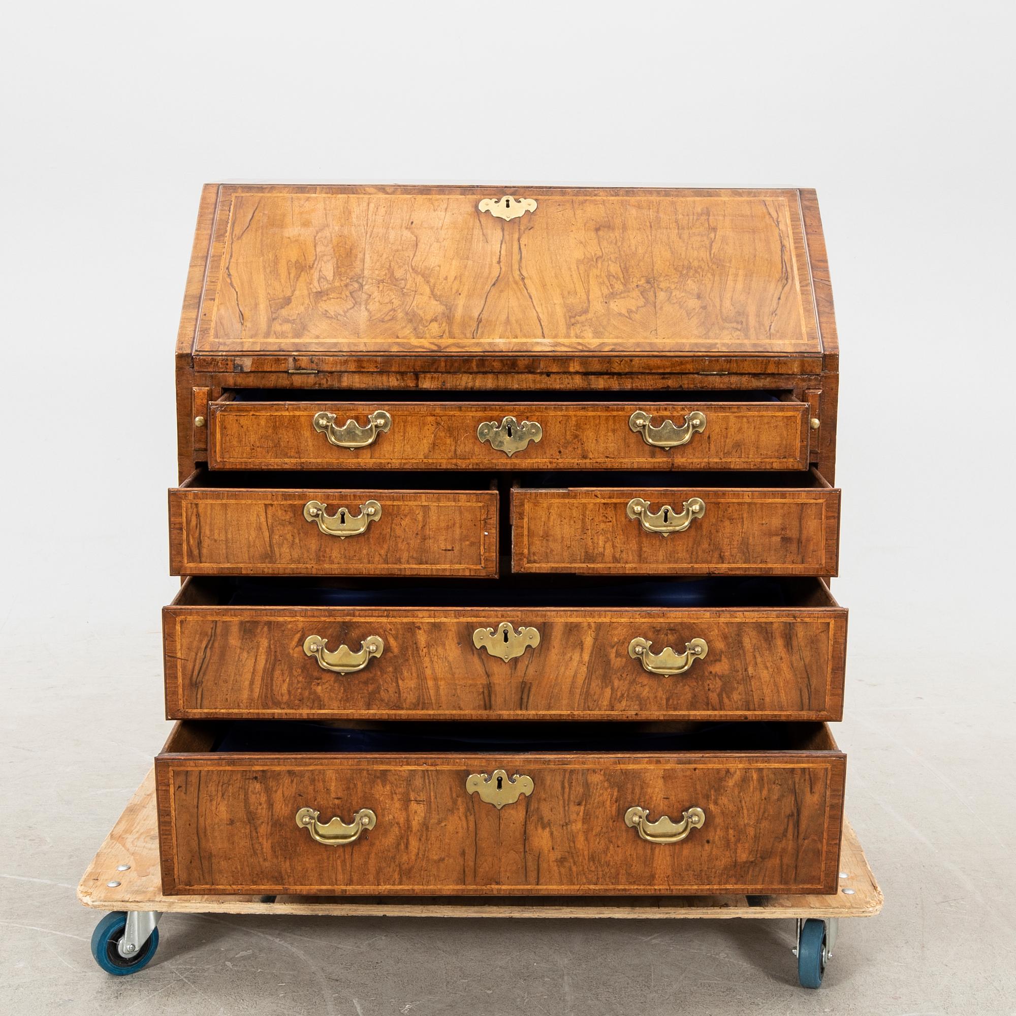 A walnut and mahogany writing bureau, mid-18th century late Baroque.