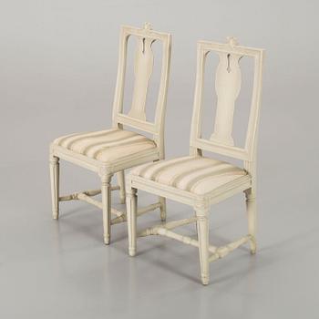 A piar of signed Swedish Gustavian chairs.